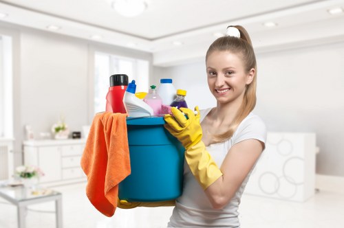 Professional cleaners maintaining a local office kitchen