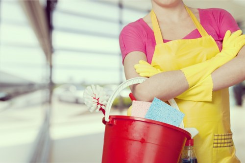 Local office cleaning service tidying desks and shared workspaces in N19