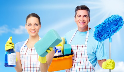 Trained carpet cleaner using safe cleaning practices and PPE